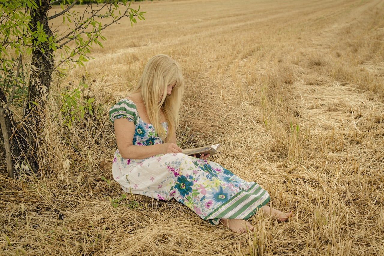 woman reading in a field